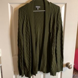 Green cardigan sweater with suede elbow patches.
